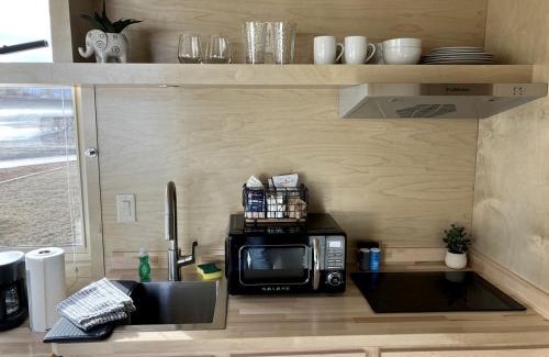 Pear Park House | Tranquil Tiny House Hideaway in Colorado: Peaceful Waterside Bliss in Grand Junction