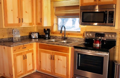 Cat Spring Cabin | Tranquility Cabin Surrounded By Live Oak Trees With A Fabulous Hot Tub!