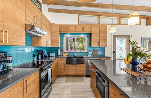 Cocoa Beach House | Tropical Backyard Oasis W/ Dock, BBQ Grill, Heated Pool, & Spa!