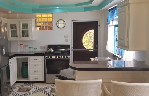 Dennery Apartment | Tropical spanish style suite with a fantastic mountain view