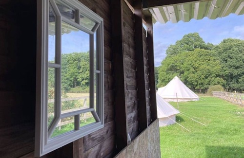 New Forest District RV Rental | Unique Bell Tent Village, sleeps up to 16, fire pit, gin bar