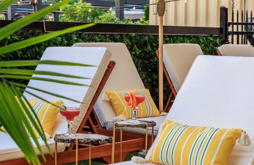 East Cesar Chavez House | Unit 2+3 Inn Cahoots on 6th: 10BR/26 Bed - Pool, Roofdeck, Garden Bars, Walk To Everything!