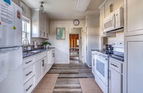 Bay City House | Updated Bay City Home Has Sunny Great Room, Fenced Yard, Deck, and Game Room!