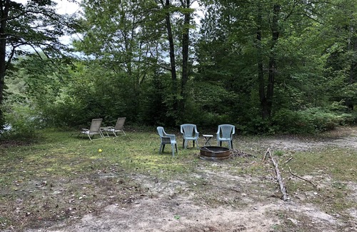 Petoskey Cabin | very private,adorable rustic cabin -out house , full shower house off barn