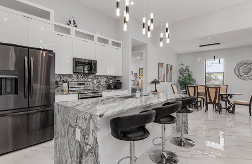 Jacarandas Villa | Villa Del Sol Vacation Pool home with outdoor TV and work/office room.