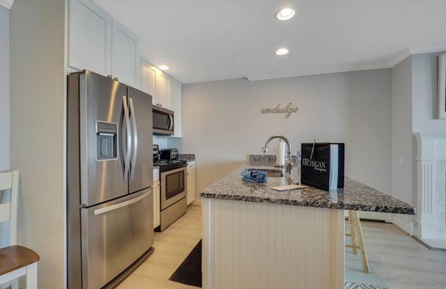 Boyne City Condo | Walk-Out to Lake Charlevoix | Private Beach & Balcony | Downtown Boyne City |