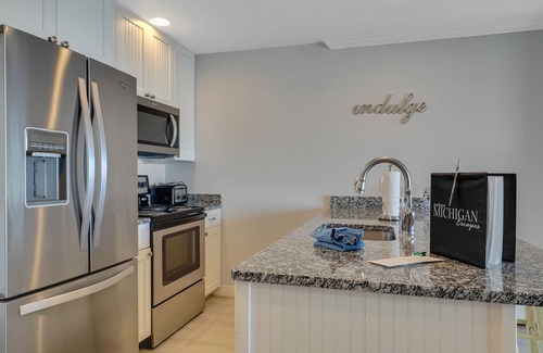 Boyne City Condo | Walk-Out to Lake Charlevoix | Private Beach & Balcony | Downtown Boyne City |