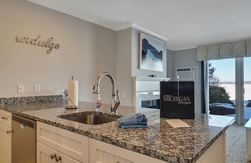 Boyne City Condo | Walk-Out to Lake Charlevoix | Private Beach & Balcony | Downtown Boyne City |