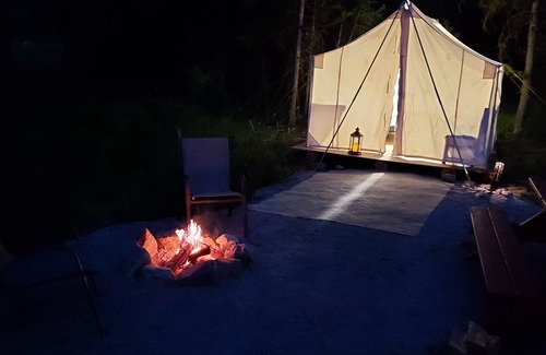 Libby RV Rental | Wall Tent by Happy's Inn with trails to Crystal Lake, bring your own bedding.