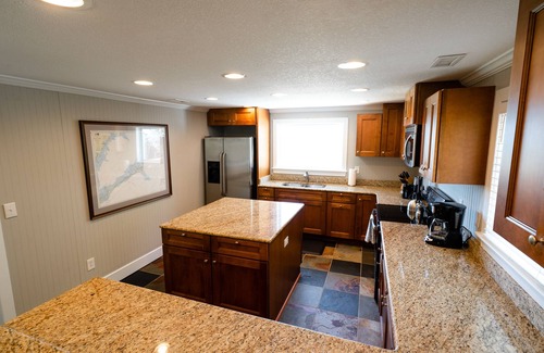 Waves Cottage | Waterfront 2-Bedroom, 1-Bathroom Cottage with a Hot tub and Waterfront Deck