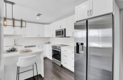 Seybold House | Waterfront Hot Tub, Heated Pool, Outdoor Lounge & Grill, King Beds