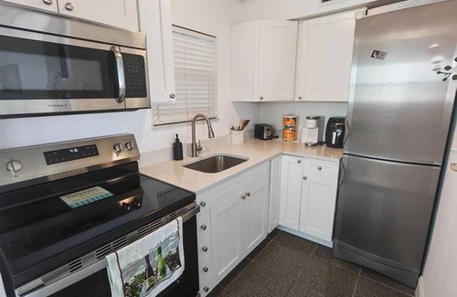 Capri Isle Condo | Waterfront Treasure Island Oasis, Dock, Sunsets & Walk to Beach + John’s Pass