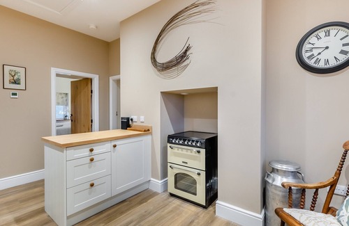 Driffield Cottage | We love this historic lodge with large garden and wood fired hot tub.