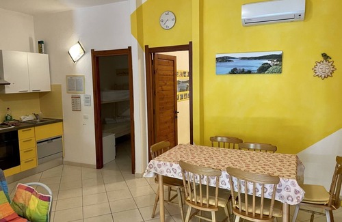 Santa Margherita di Pula Apartment | Yellow House with garden, 130 meters from the beach