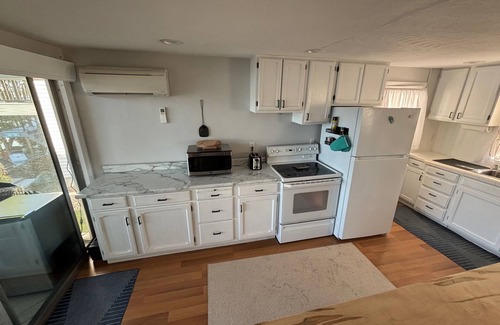 Edwardsburg House | Your Eagle Lake Escape: Dock, Deck, and Notre Dame Access.