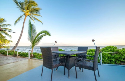 Kaunakakai House | Your Ultimate Oceanfront Retreat | Relaxing Room with Lush Garden View
