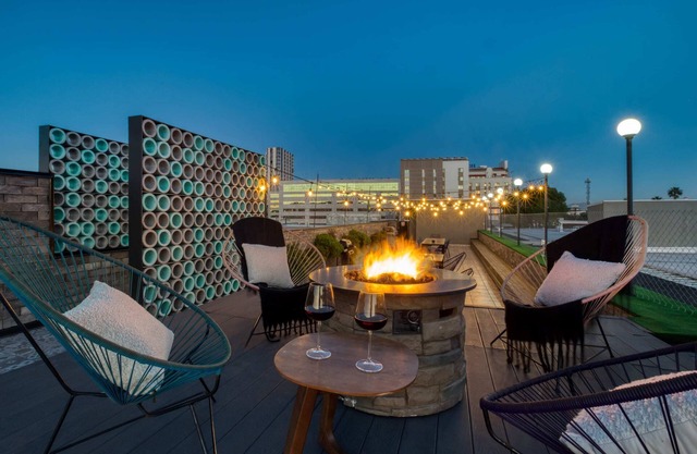 2BR Apt w/Balcony: Gym, Rooftop+Fire Pit, Lounge/Games