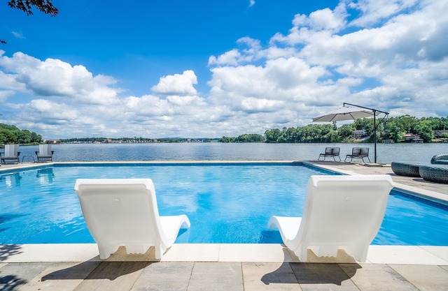 3-home lakefront retreat with outdoor pool, fireplaces, grills, patios, & views