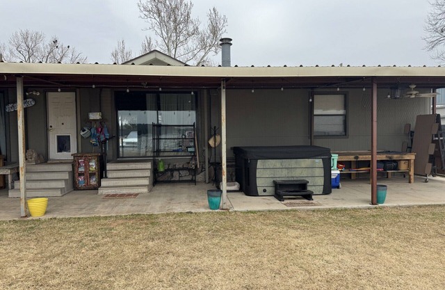 3B/3B Lake front property with dock, hot tub, and entertainment area outside!
