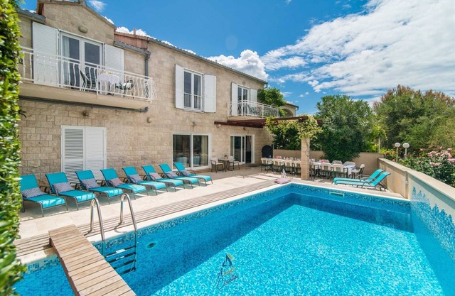7-BR Beachfront Villa with Seaside Terrace and Heated Swimming Pool