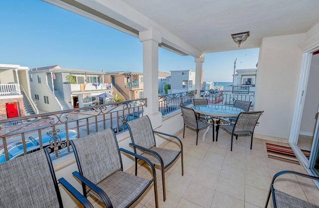 7BR Retreat with Ocean View Balcony & Patio, Just Steps from the Sand!