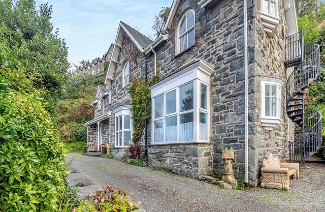 A large detached mansion with open fire and cinema room.