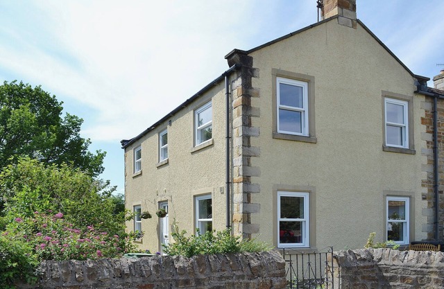 A pretty stone cottage in the conservation village of Redmire.