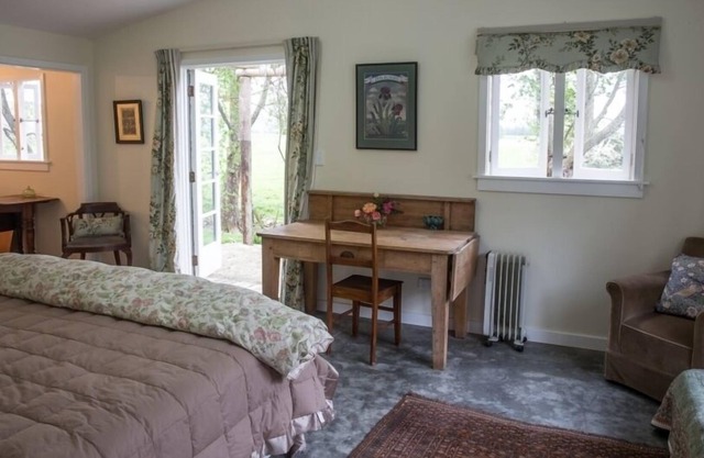 A shady flat with a view and a pergola of roses