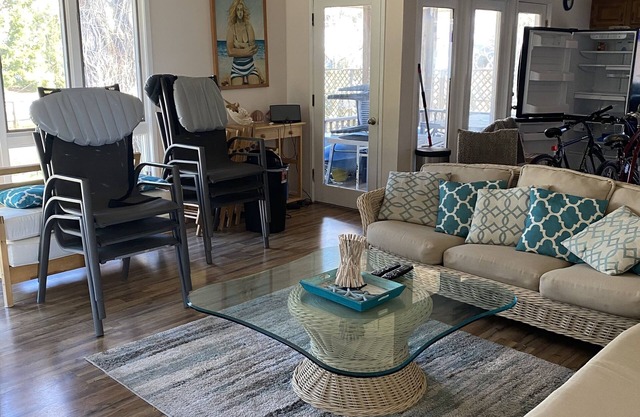 Activities included up to $300 FREE PER WEEK! FREE DAILY ACTIVITIES! Charming 3 bedroom, 2 bath beach cottage located on the canal with a dock.