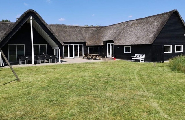 Activity house under thatch with pool, whirlpool, sauna and activity room