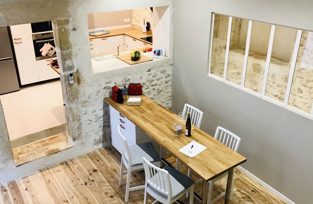 Air-conditioned house with patio in the heart of the village near the river