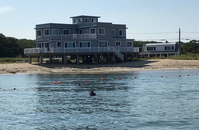 AMAZING BEACH HOUSE LOCATED IN DESIRABLE POINT O' WOODS COMMUNITY