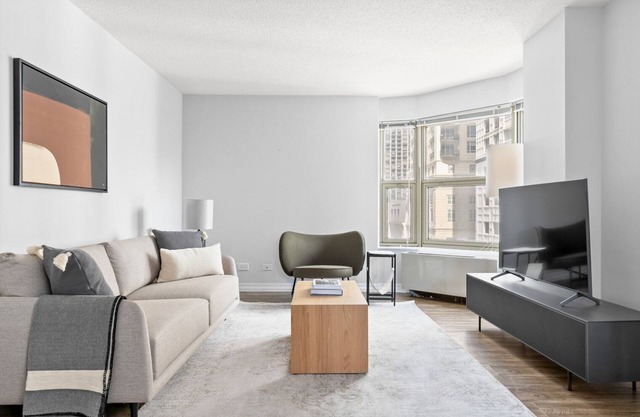 Amazing Gold Coast 1BR w/Deck, Gym & Lounge, 1 block to L, by Blueground