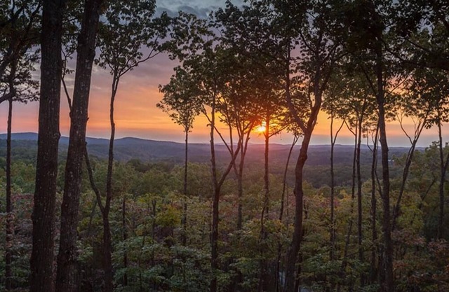 Amber Sunsets dazzles with panoramic views, hot tub luxury, a custom firepit, screened porch, pool table, and pet-friendly hospitality!