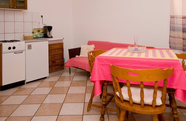 Apartment on the seafront of the island of Rab with private beach