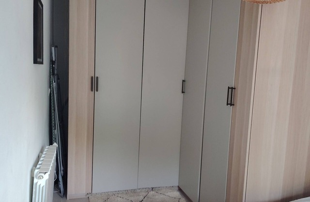 At the foot of Notre Dame de la Garde, between beach and town center