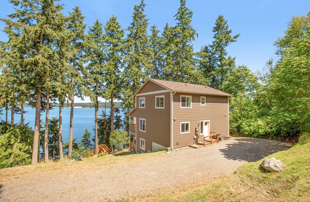 Beachfront 3-story home w/deck, bay views, hot tub, game room, WiFi, EV charger