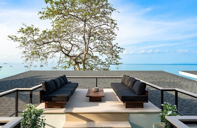 Beachfront 9BR Sunset Villas w/Staff & Saltwater Infinity Pools