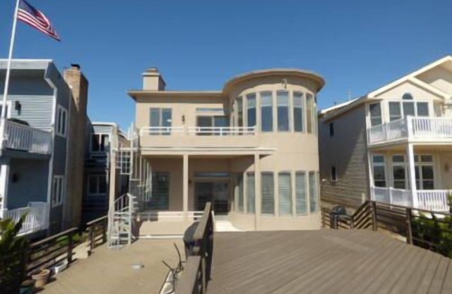 Beachfront beauty! First floor-step out your back door to your own deck and onto beach