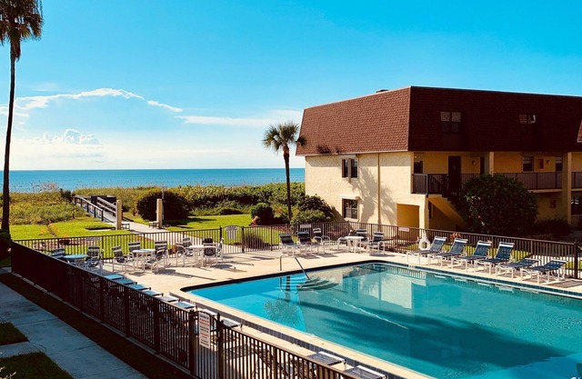 BEACHFRONT PARADISE -2BR Townhouse with Balcony, Pool, and Private Beach Access