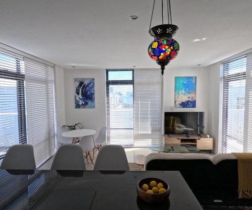 Beachfront Penthouse with patio and free parking