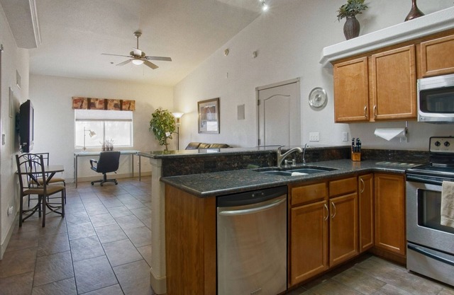 Beautiful 1 Bdrm Villa! Overlooks Pool with 44' Deep 13'6" High Attached Garage