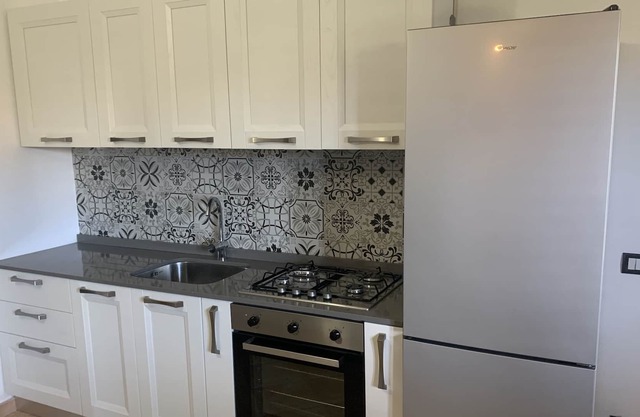 Beautiful beach front apartment with large private garden in a gated development