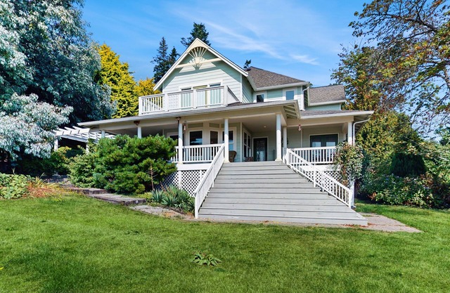 Beautiful home with foosball table, waterfront views, fireplace, basketball cour