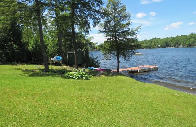 Beautiful lakeside 4 bedroom retreat with private dock and walkout basement
