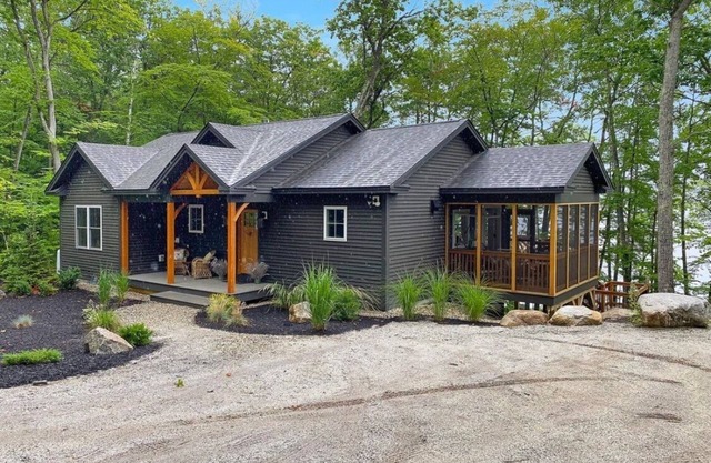 Beautiful new modern cabin with 100 feet of shoreline on Long Lake