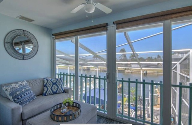 Beautiful SJC Island Condo w/heated pool on main canal, great fishing!