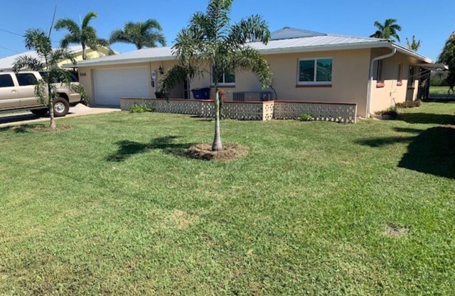 BEAUTIFUL WATERFRONT HOME WITH SALTWATER POOL AND CANAL ACCESS