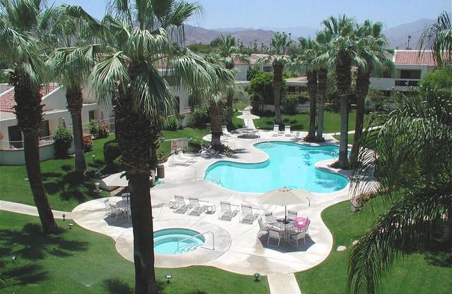 Breathtaking mountain views from this very private, updated Mid Century condo!