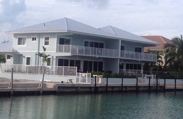 Canal front with Pool & 50 feet of Dock on each side/Cabana Club Included!